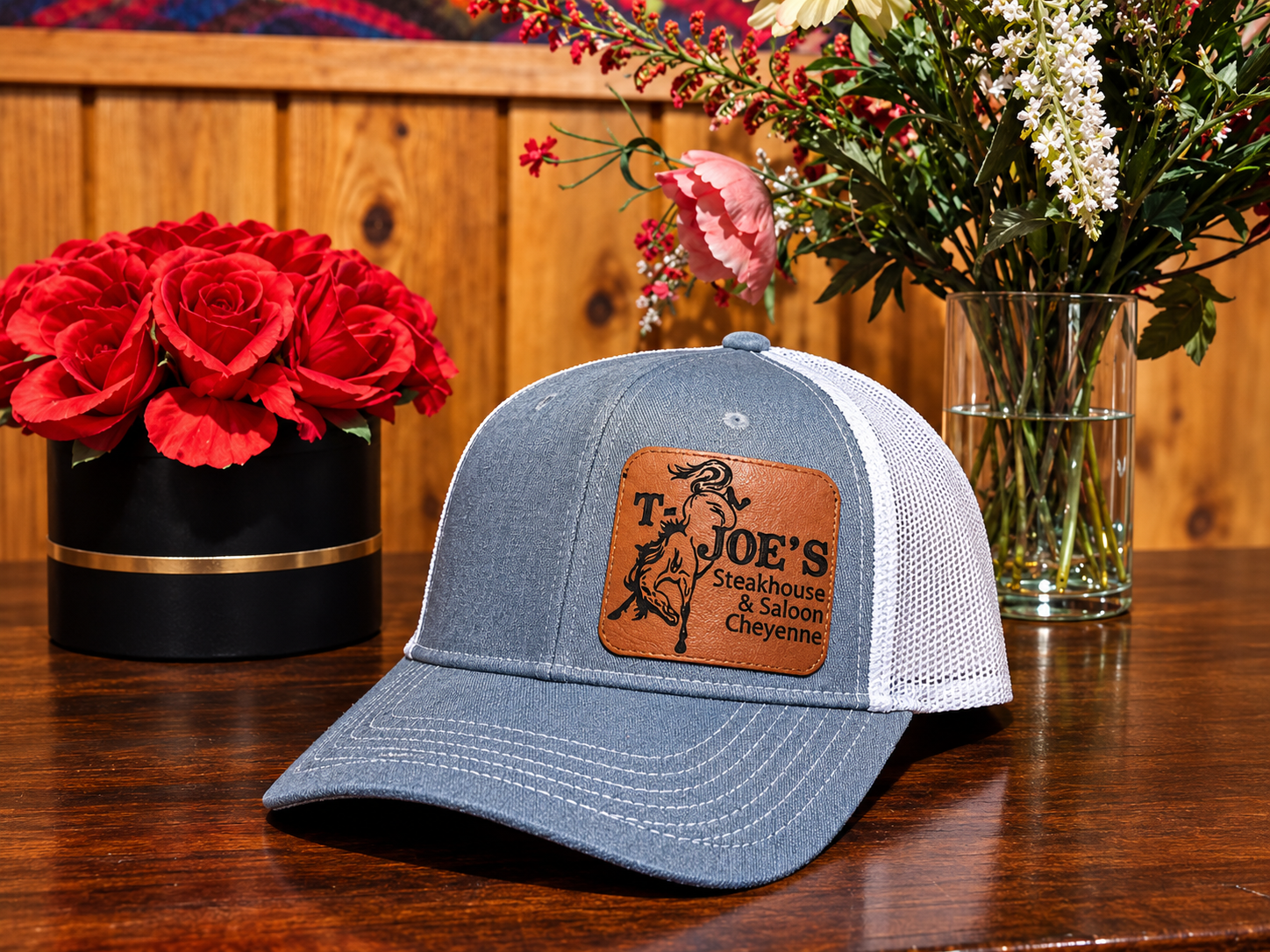 T-Joe's Steakhouse & Saloon leather patch trucker cap in denim and white